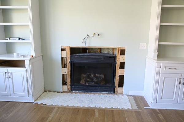 Upgrade your fireplace in a weekend! Get a step by step tutorial on how to install a marble herringbone fireplace surround and hearth.