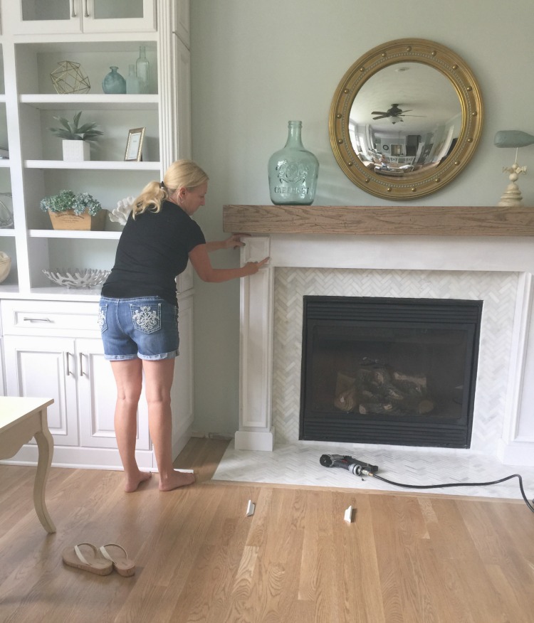 Learn how to make a rustic weathered oak DIY Wood Beam Mantel and fireplace surround. This mantel has a hollow center to hide electrical cords or items.