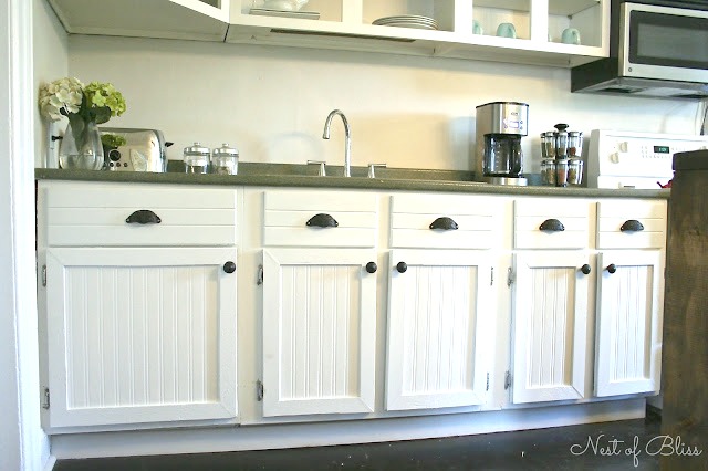 Custom adding beadboard to kitchen cabinets Budget Cabinet Makeover Sand And Sisal