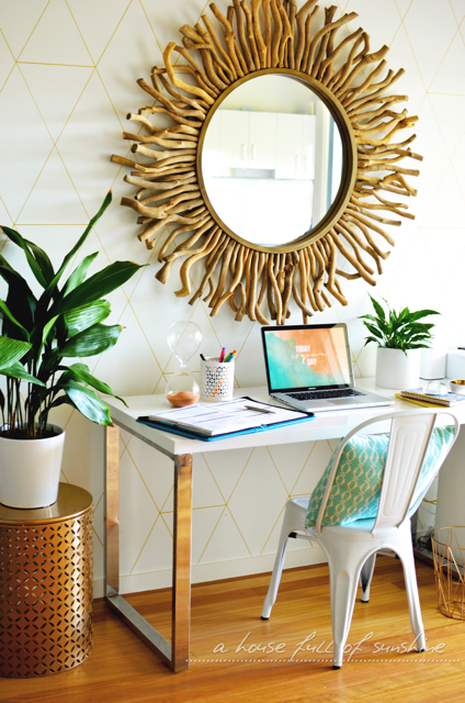 Home office with gold paint pen wall