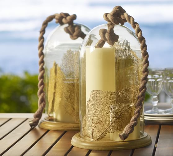 rope-handle-blown-glass-cloche: Capture a bit of summer under a cloche or glass bell jar. Explore these beautifully chic coastal cloche decor ideas for your home.