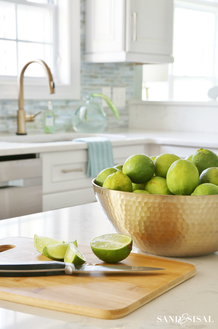 blanco-silgranit-farmhouse-sink-delta-champagne-bronze-trinsic-faucet-coastal-kitchen  - The Leslie Style