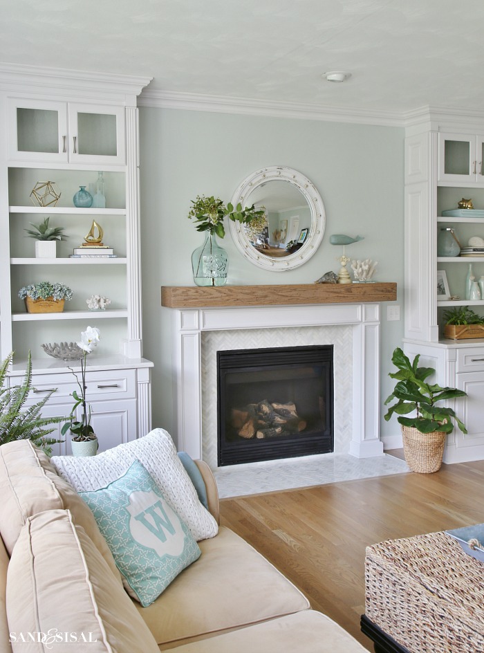 Coastal Familyroom with Builtins and Wood Beam Fireplace